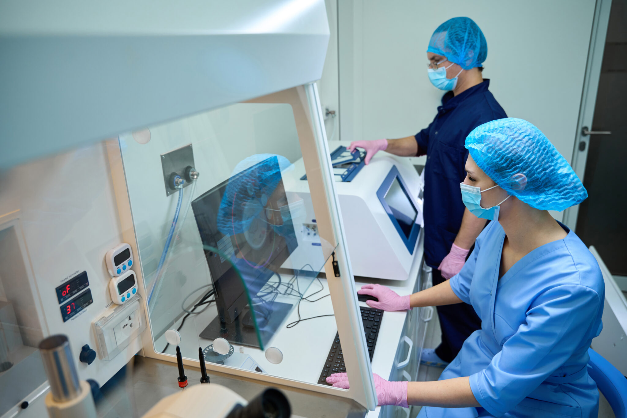 doctors inspect analysis data and adjust lab equip 2024 10 20 00 29 27 utc 1